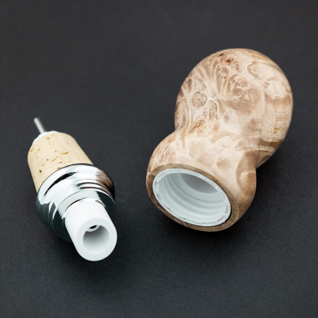 Pour spout bottle stopper project kit made with a Maple burl wood bottle stopper blank from William Wood-Write Ltd against black background