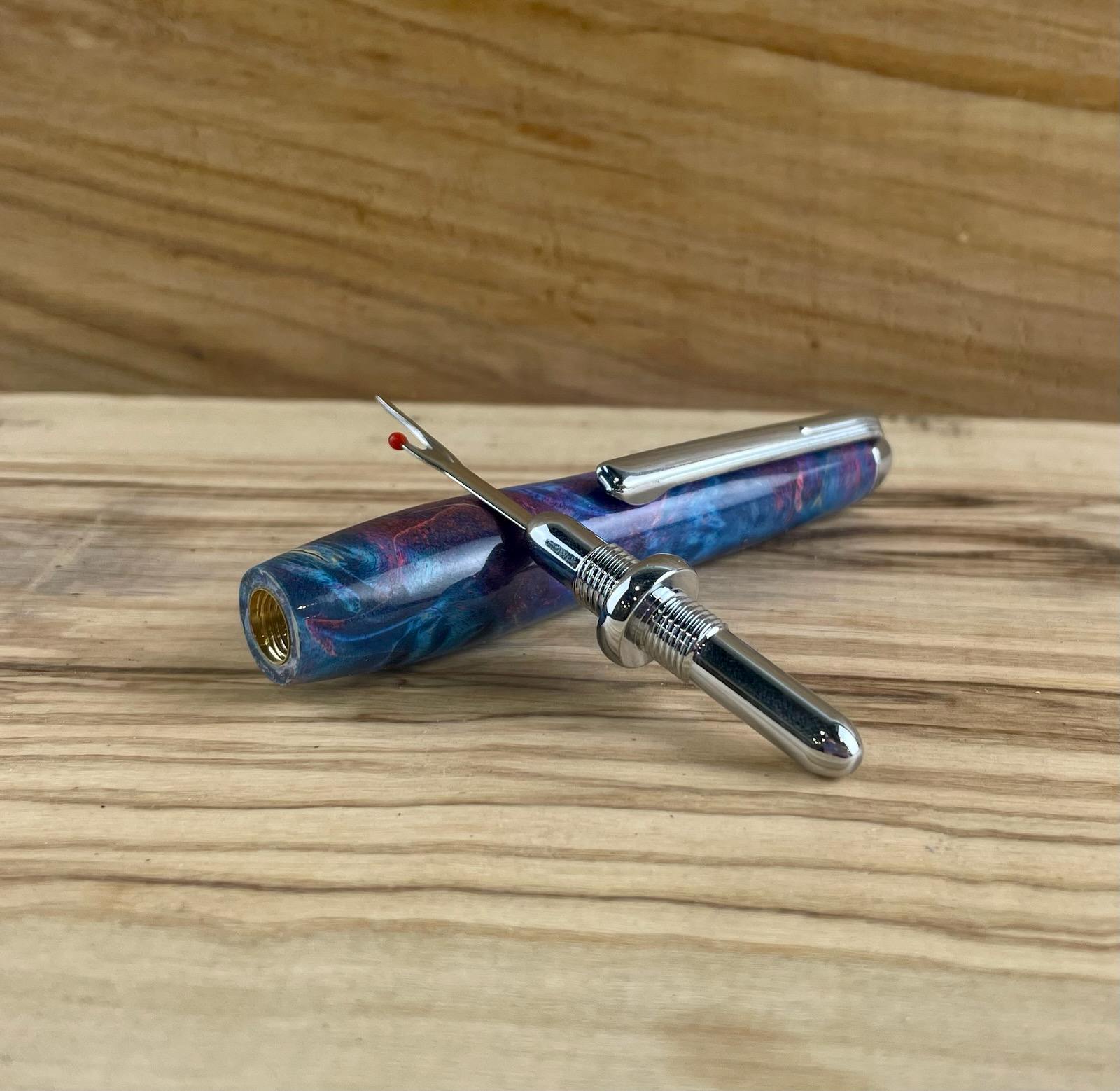 Single seam ripper project kit from William Wood-Write Ltd in chrome, made with stabilized Buckeye Burl wood pen blank in doubled dyed blue and pink