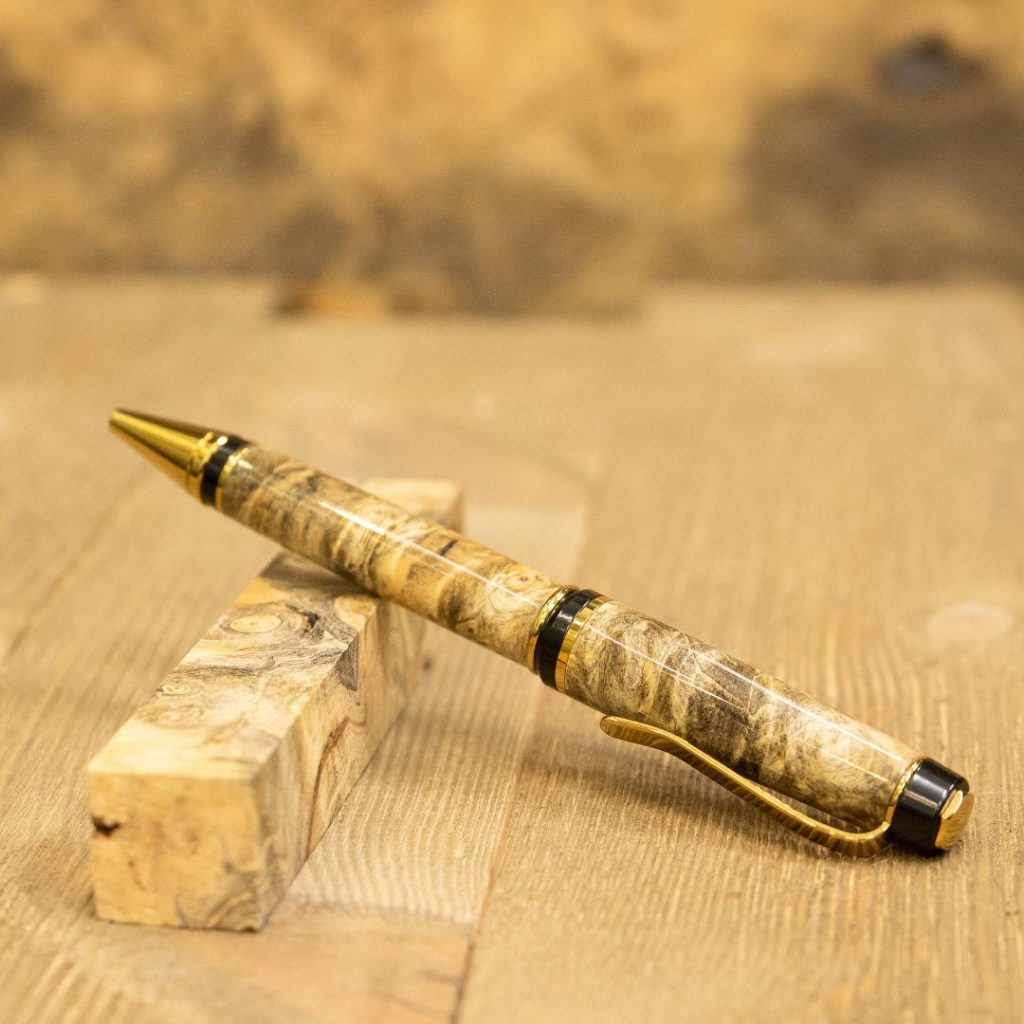 Titanium gold budget cigar pen turned with a natural stabilized buckeye burl pen blank from William Wood-Write Ltd.