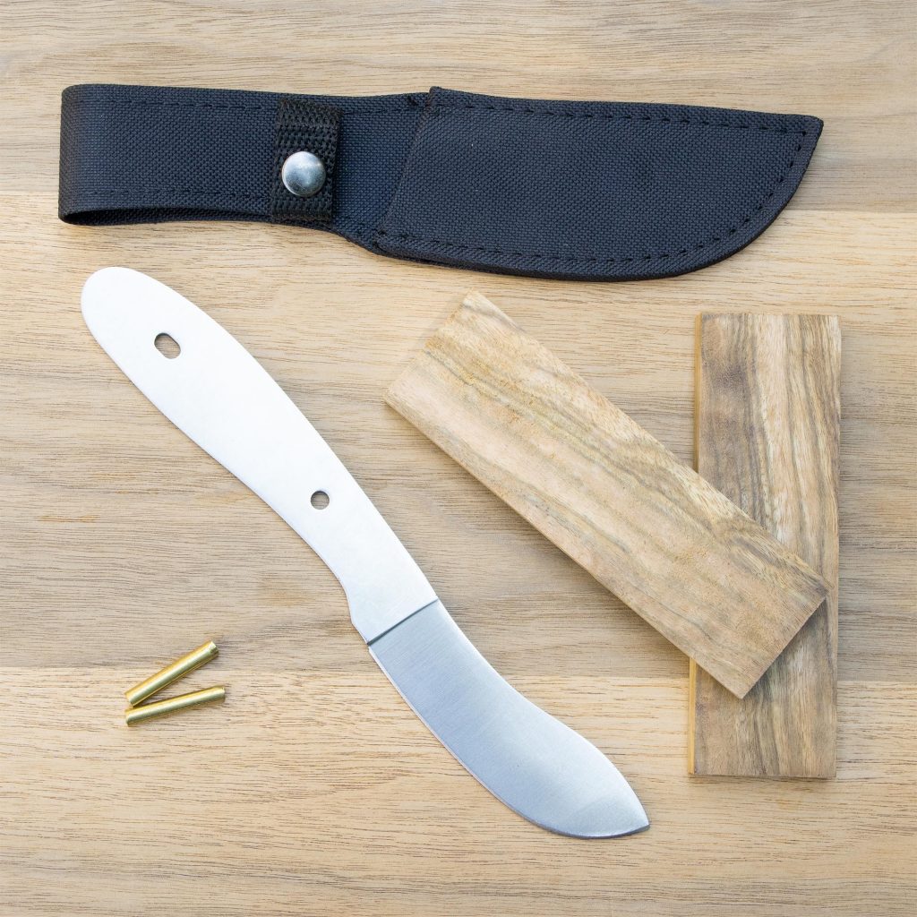 Bison Skinner Knife Blade kit next to knife scales and brass pins from William Wood-Write Ltd.