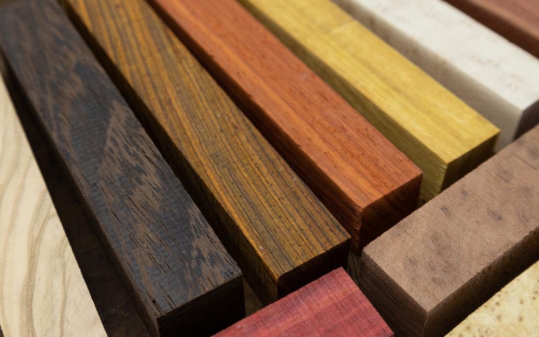 Exotic Wood pen blanks lined up on a table, close up, from William Wood-Write Ltd.