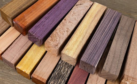 A selection of wooden pen blanks for wood turning in various colours.