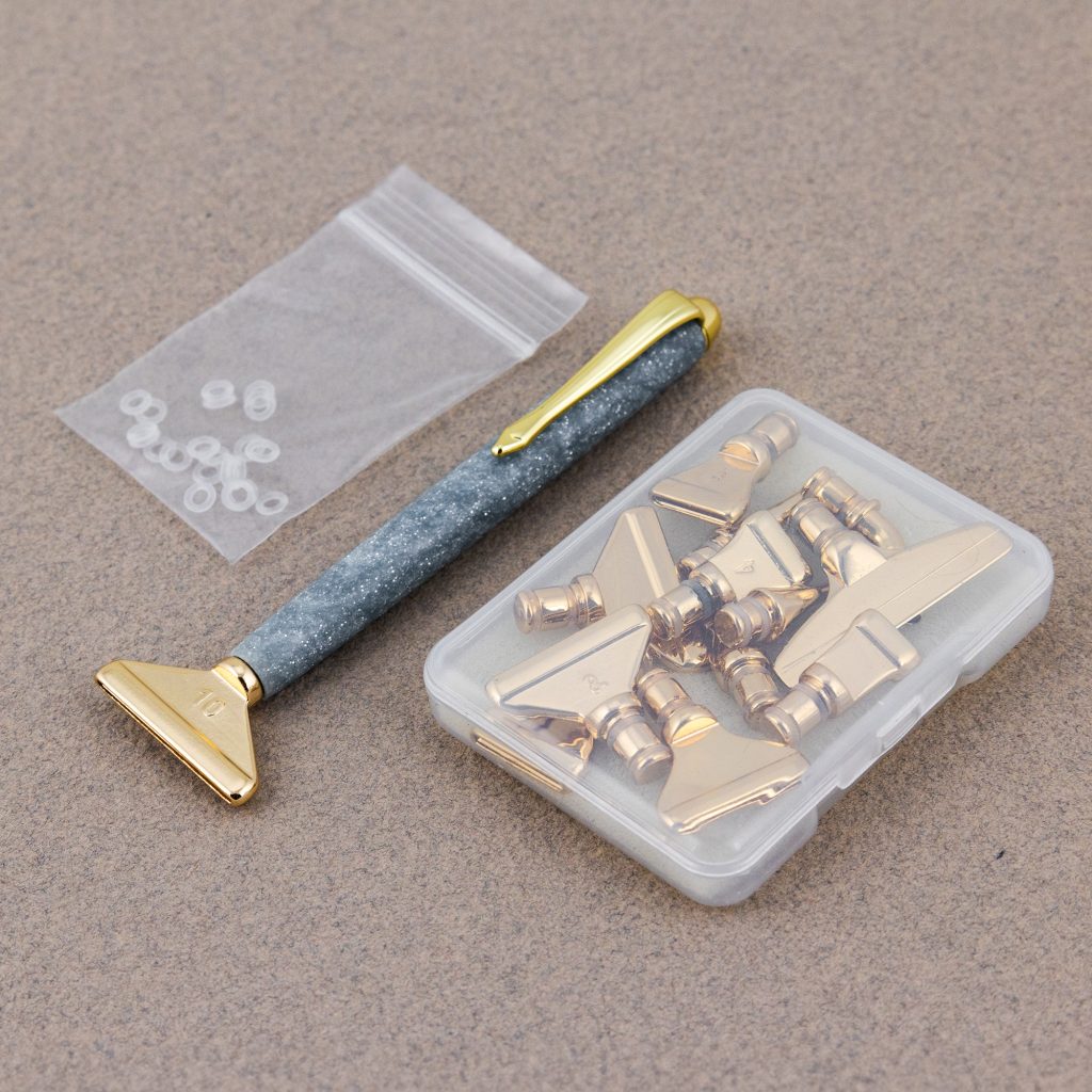 A custom made diamond painting tool made on a lathe