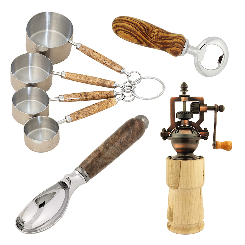 A selection of wood turned kitchen utensils including a set of measuring cups, ice cream scoop, bottle opener and pepper grinder.