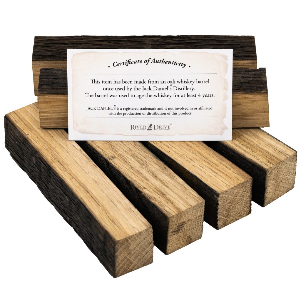 An assortment of pen blanks made from the wood of Jack Daniels whiskey barrels with a certificate of authenticity.