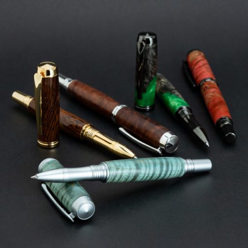 A variety of woodturned rollerball pens in various platings with colourful blanks