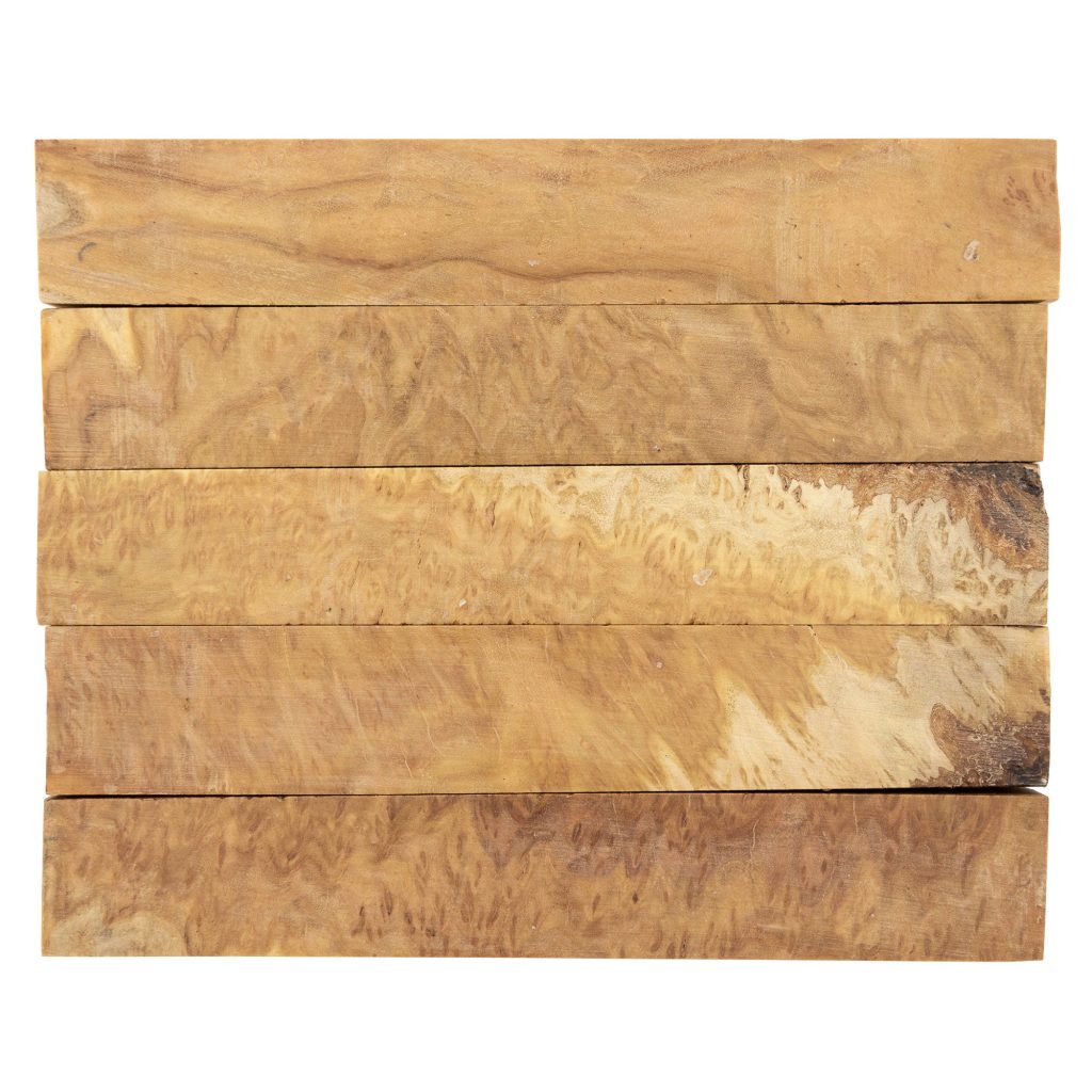 Five pen blanks cut from yellow box burl wood for turning, which is dark yellow with swirling patterns
