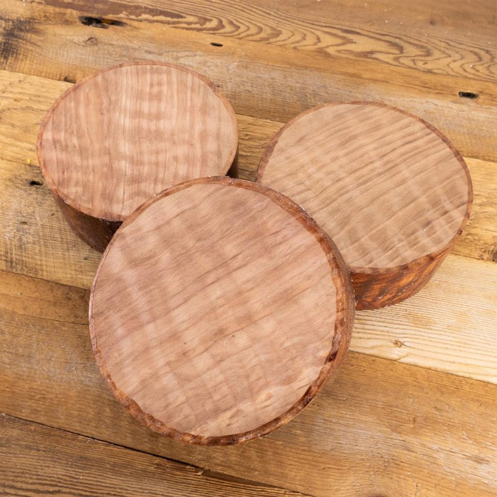 Three round peices of redwood for turning bowls on a lathe